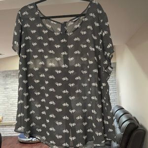 Torrid sheer bicycle top with back buttons.